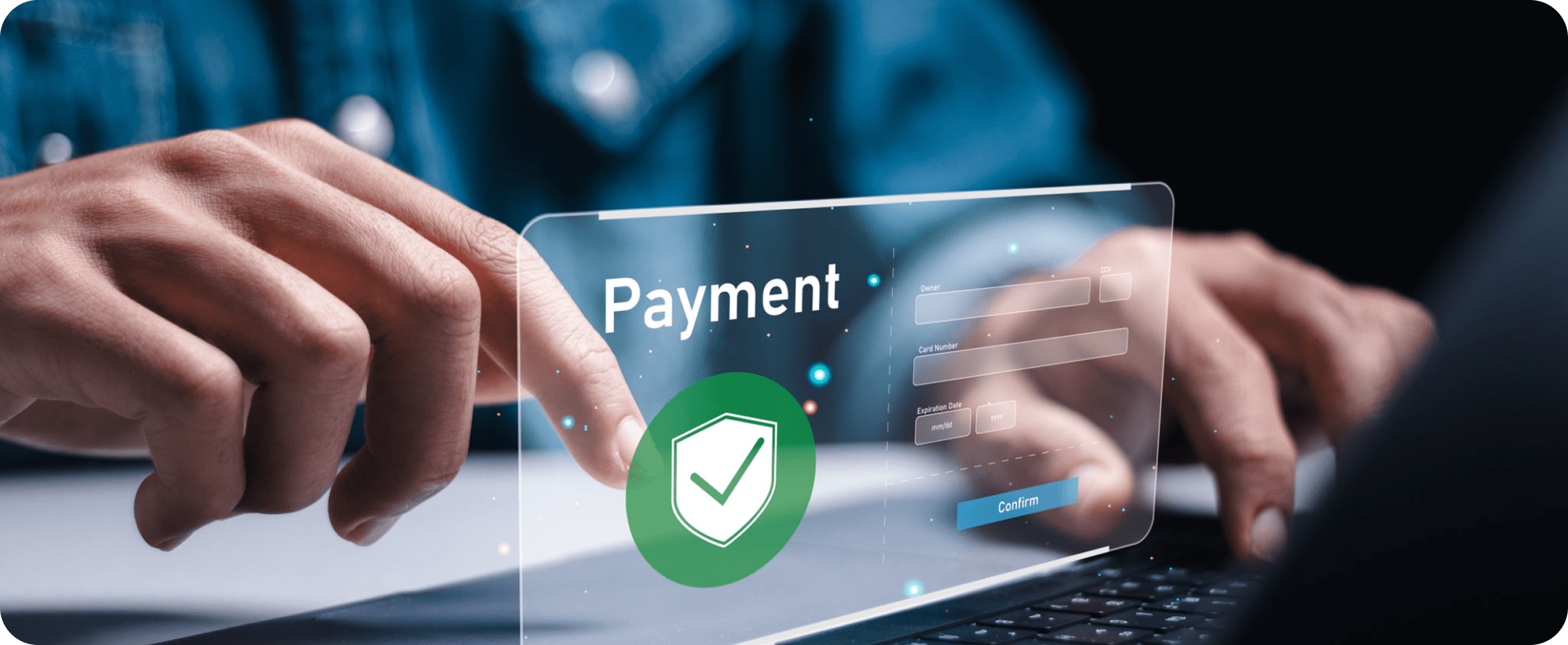 Hands typing on laptop with payment screen
